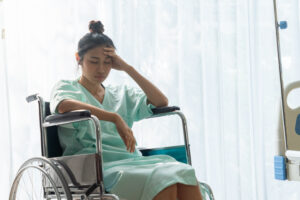 Medical Malpractice - Frustrated and injured woman in a wheelchair